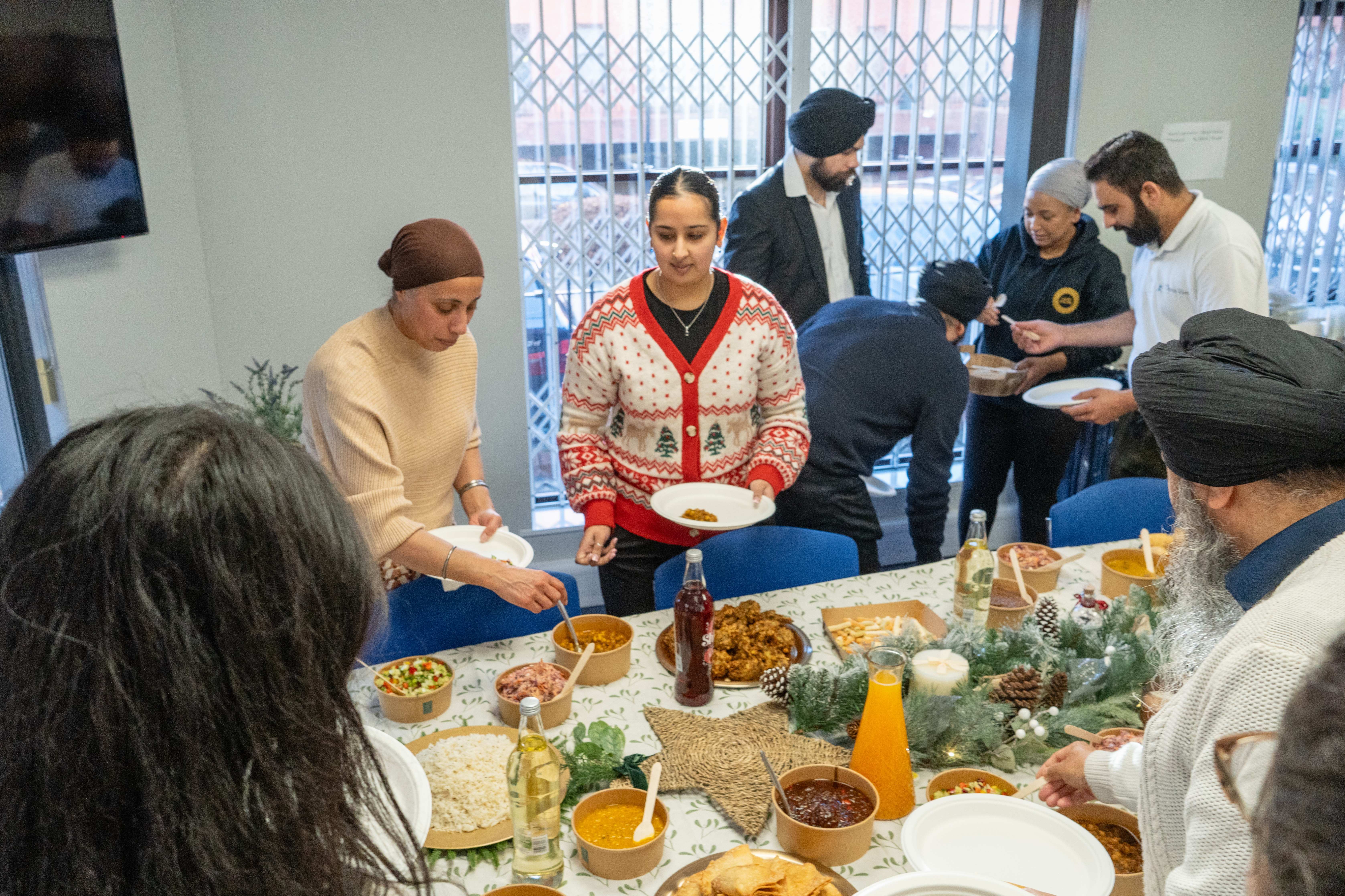 Office catering event with team serving food